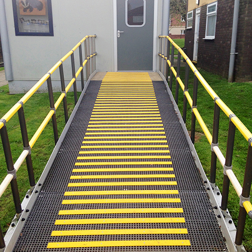 Classroom access ramp with decking strips to create a safer environment. Classroom access ramp with decking strips to create a safer environment.