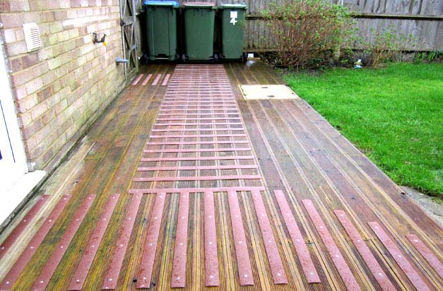 Back garden decking and bin area - a potential slip hazard made safe with decking strips. Back garden decking and bin area - a potential slip hazard made safe with decking strips.