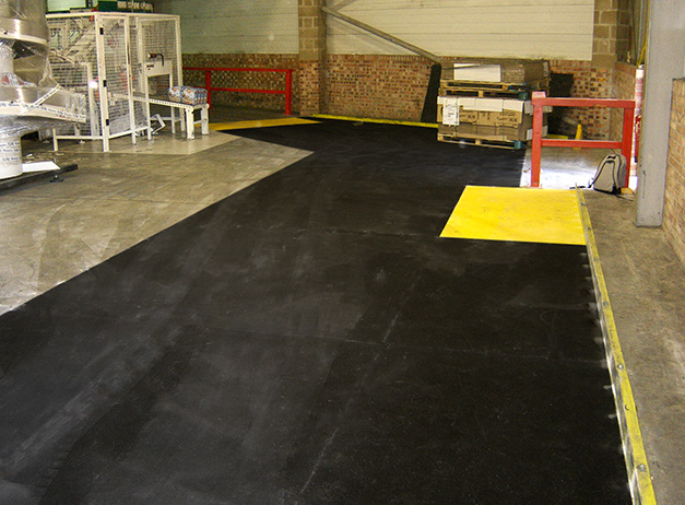 Heavy use factory loading bay area with floor sheet anti-slip areas. Heavy use factory loading bay area with floor sheet anti-slip areas.