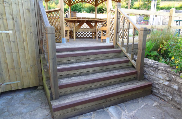 Slippery wooden steps with brown anti slip stair nosing. Slippery wooden steps with brown anti slip stair nosing.
