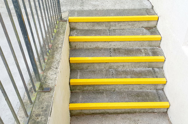 Basement stairway entrance anti-slip stair nosing installation. Basement stairway entrance anti-slip stair nosing installation.