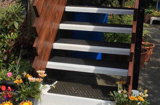 Garden flat entrance made safe with black and white anti slip stair treads. Garden flat entrance made safe with black and white anti slip stair treads.