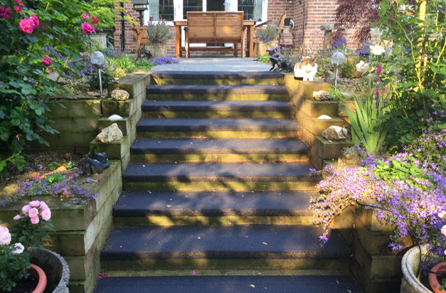 Black anti slip stair treads garden landscape installation. Black anti slip stair treads garden landscape installation.